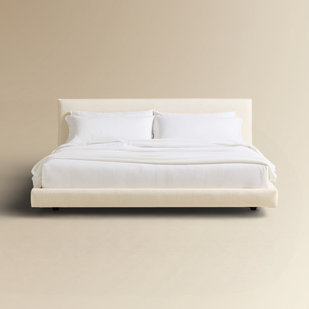 Louis luxury ivory fabric platform bed with a wide cushioned headboard and minimalist silhouette.