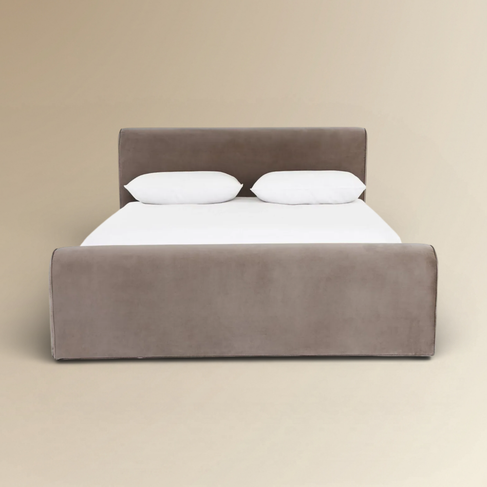 Merano luxury velvet platform bed with a cushioned headboard and a sophisticated taupe fabric finish.